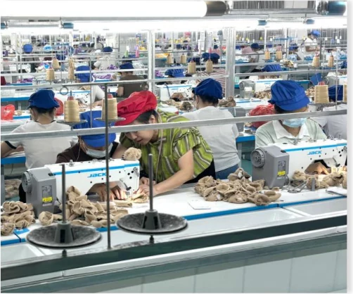 Sewing team assembling plush pieces in the TGS production workshop